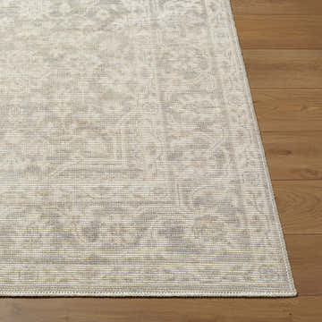 Close-up of Maan Machine Woven Nabela Noor Home x LIVABLISS rug showing gray, mustard, and off-white traditional design. Front