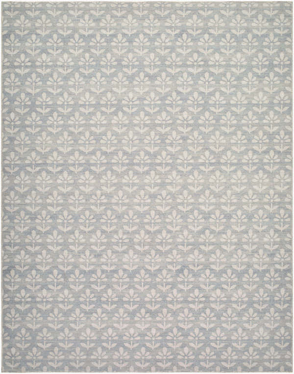 Close-up of the Maya Machine Woven Nabela Noor Home x LIVABLISS NBMY-2301 Area Rug. Sky blue rug with off-white floral pattern. Design-Rectangle-71010