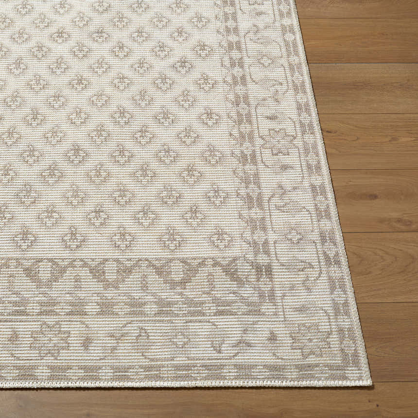 Close-up of the neutral Cicely Area Rug showing its traditional pattern and jute texture on wood floor. Front