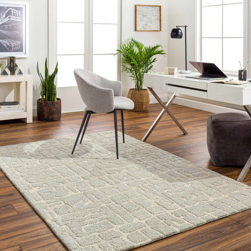 Light beige Posof Area Rug in a bright home office with white desk, gray chair, and wood floors. Roomscene-Rectangle