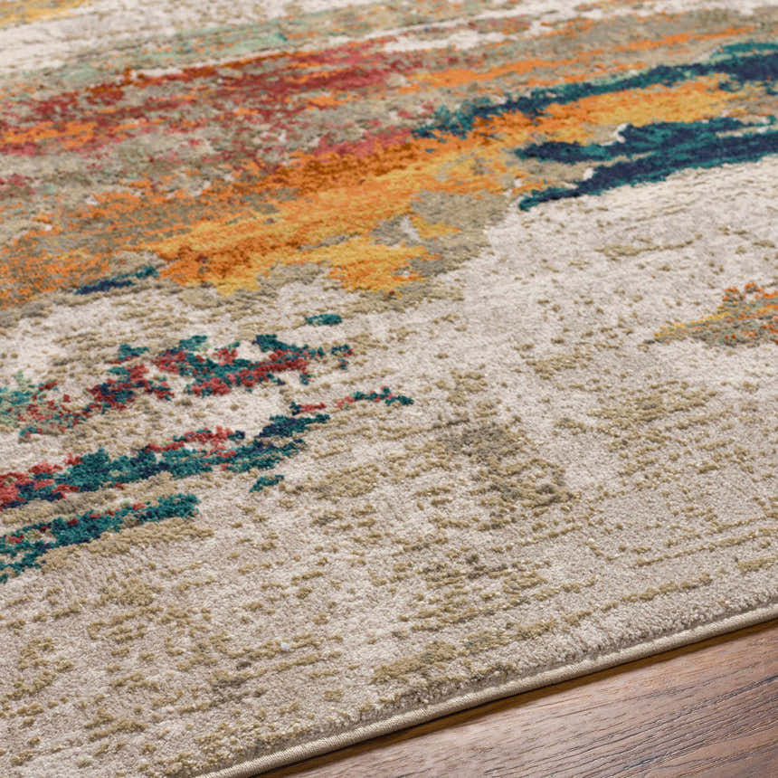 Close-up of the Pearces Area Rug showing cream, gray, mustard, and olive abstract design and soft, textured pile. Texture