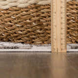 Close-up of the Benjy Cream & Charcoal Checkered Area Rug showing thickness with ruler and basket detail. Pile