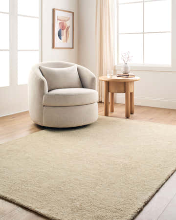 Neutral living room with a beige swivel chair and the Fupue Beige Abstract Area Rug. Roomscene-Rectangle