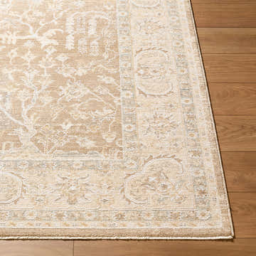 Close-up of the Gofae Tan Medallion rug showing beige, cream, and tan tones with a traditional floral pattern. Corner