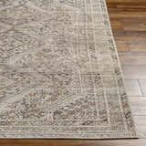 Close-up of the Barny Beige Flat Pile Washable Rug showing its traditional pattern, neutral colors, and flat weave texture. Front