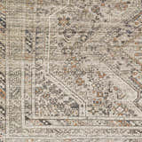 Close up of Barny Beige Flat Pile Washable Rug. Traditional design with black, gray, ivory and orange tones. Swatch