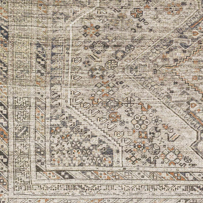 Close up of Barny Beige Flat Pile Washable Rug. Traditional design with black, gray, ivory and orange tones. Swatch