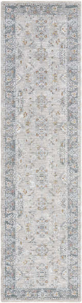 Close-up of the Greco Textured Rug with Fringes. Features a traditional, light gray floral pattern and a textured finish. Design-Runner-2710