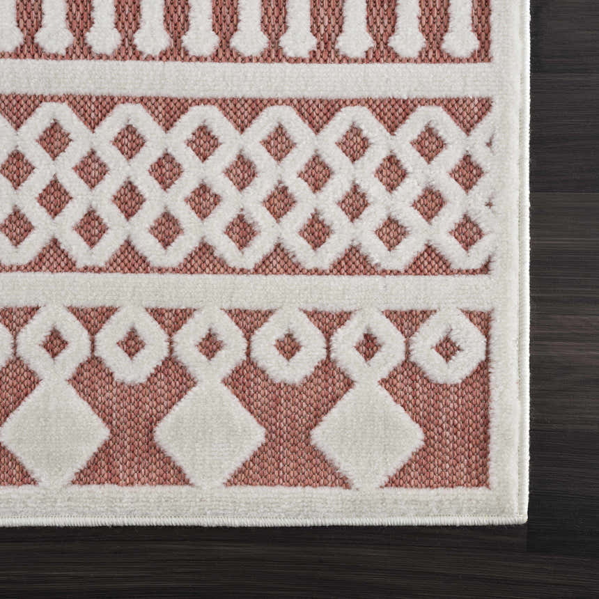 Close-up of the Jove Orange Outdoor Rug showing a bone and terracotta geometric Southwestern pattern. Swatch
