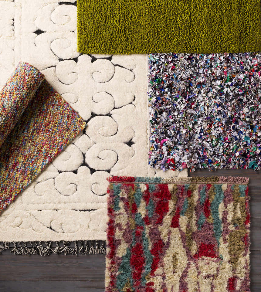 Overhead shot of various rug textures, including Frederika Olive Green Wool Shag Rug. Styleshot
