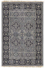 Close-up of the hand-knotted Sherwood Area Rug. Ice blue, ink blue, and teal wool rug with traditional geometric pattern. Design-Rectangle-23