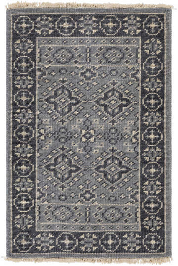 Close-up of the hand-knotted Sherwood Area Rug. Ice blue, ink blue, and teal wool rug with traditional geometric pattern. Design-Rectangle-23