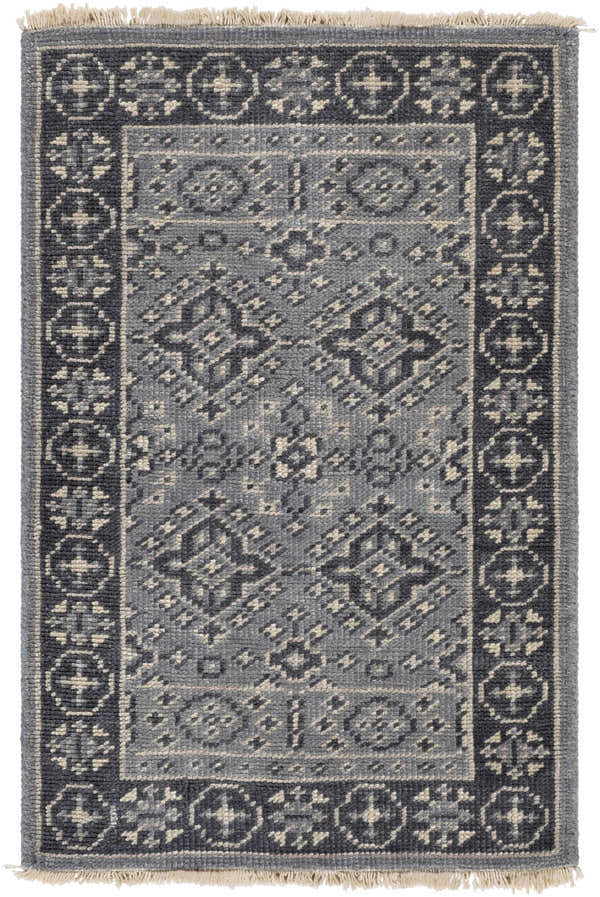 Close-up of the hand-knotted Sherwood Area Rug. Ice blue, ink blue, and teal wool rug with traditional geometric pattern. Design-Rectangle-23