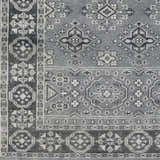 Close-up of the hand-knotted Sherwood Area Rug. Ice blue, ink blue, and teal wool with traditional Oriental patterns. Swatch