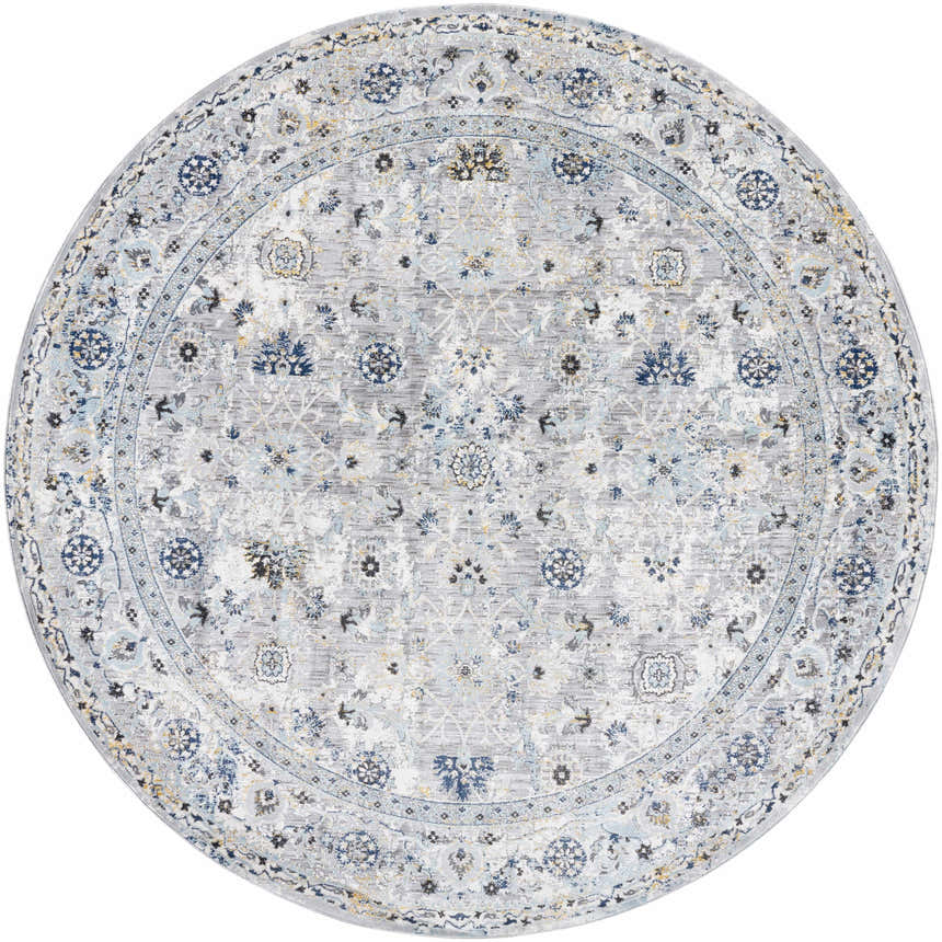 Close-up of a round Irida Area Rug. The rug has a traditional floral pattern in gray, denim, and nutmeg tones. Design-Round-710