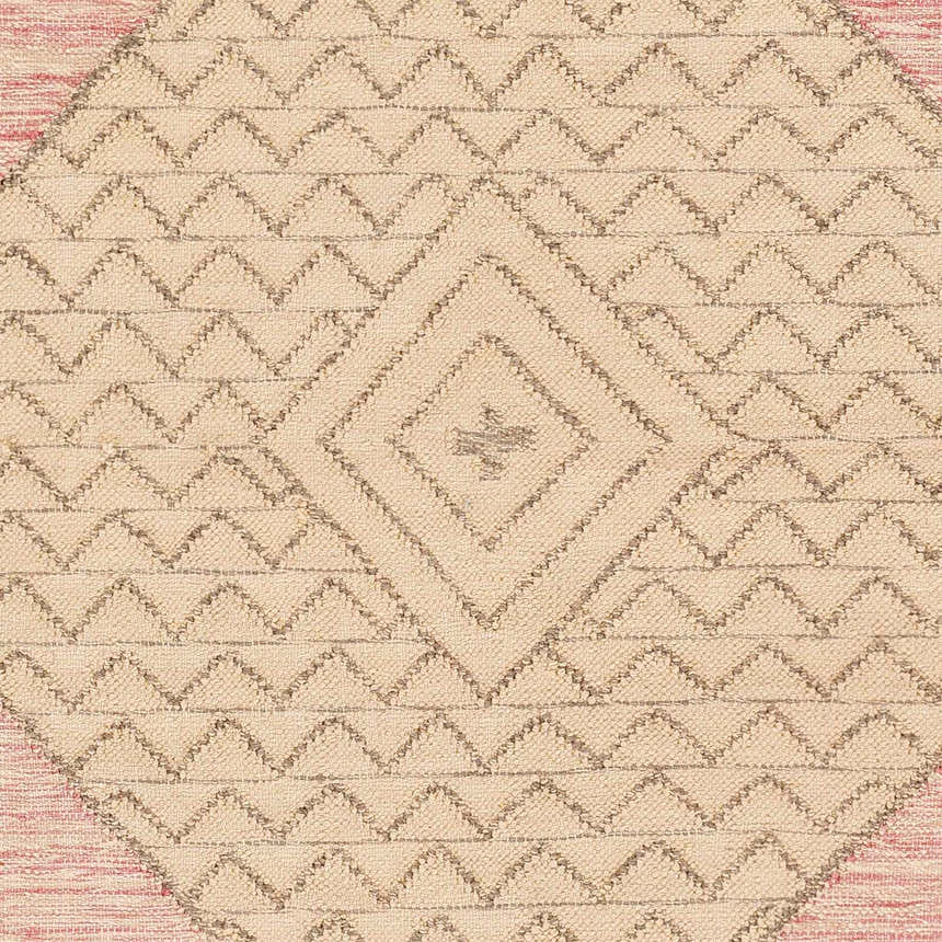 Close-up of the Sang Area Rug. Hand-woven recycled PET yarn with a tan geometric pattern on a light pink background. Swatch