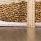 Close-up of the Kandos Blush & Light Pink Area Rug showing the pile height with a ruler for scale. Pile