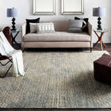 Living room scene with a beige sofa and Streatley Area Rug in beige, black and gray. Contemporary style. Roomscene-Rectangle