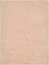 Close-up of the hand woven Kanuha Washable Area Rug. Plush, blush pink wool rug with a subtle texture. Design-Rectangle