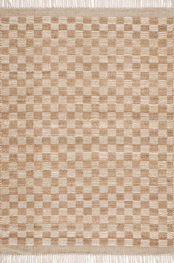 Close-up of the Ionut Checkered Jute Area Rug. Beige and tan squares create a classic checkerboard pattern. Hand-woven texture. Design-Rectangle