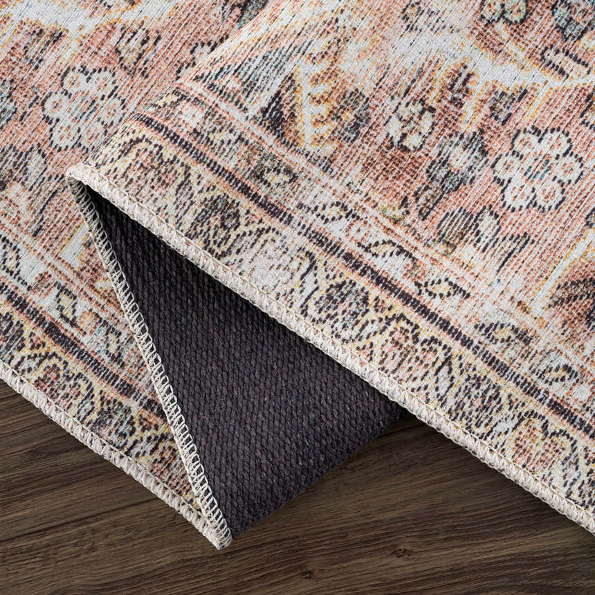Close-up of the Flat Pile Urpi Red Washable Rug showing its traditional Persian-style pattern and flat weave texture. Fold