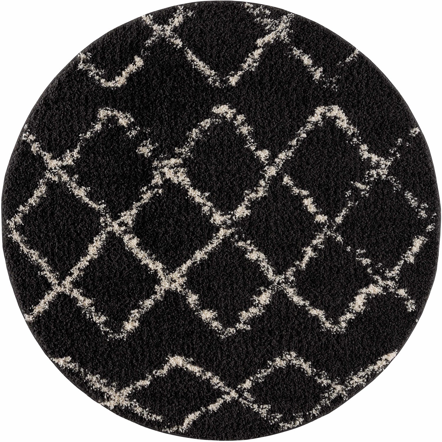 Close-up of a round Wallagrass Black Moroccan Shag Rug. Charcoal rug with light beige geometric diamond pattern. Shag texture. Design-Round