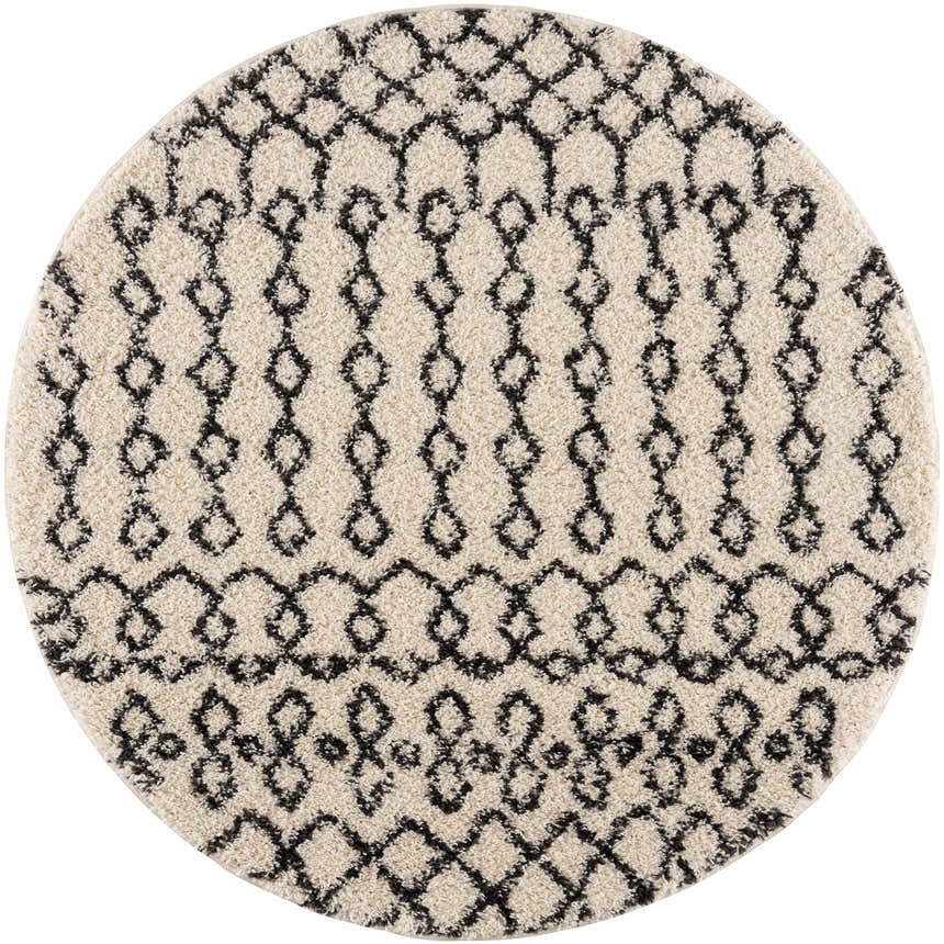 Round Muni Berber Shag Rug in light beige and charcoal, featuring a geometric Moroccan-inspired pattern. Close-up product shot. Design-Round