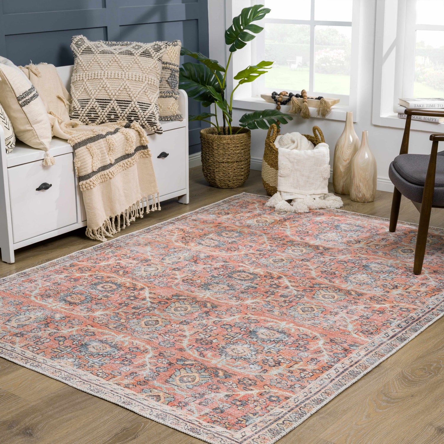 Living room scene with Urpi Rose & Blue Washable Area Rug. Farmhouse style with peach, blue, and cream tones. Roomscene-Rectangle