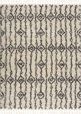 Close-up of the Bayanga rug, a shag rug with a black geometric Moroccan-inspired design on a light gray background. Design-Rectangle