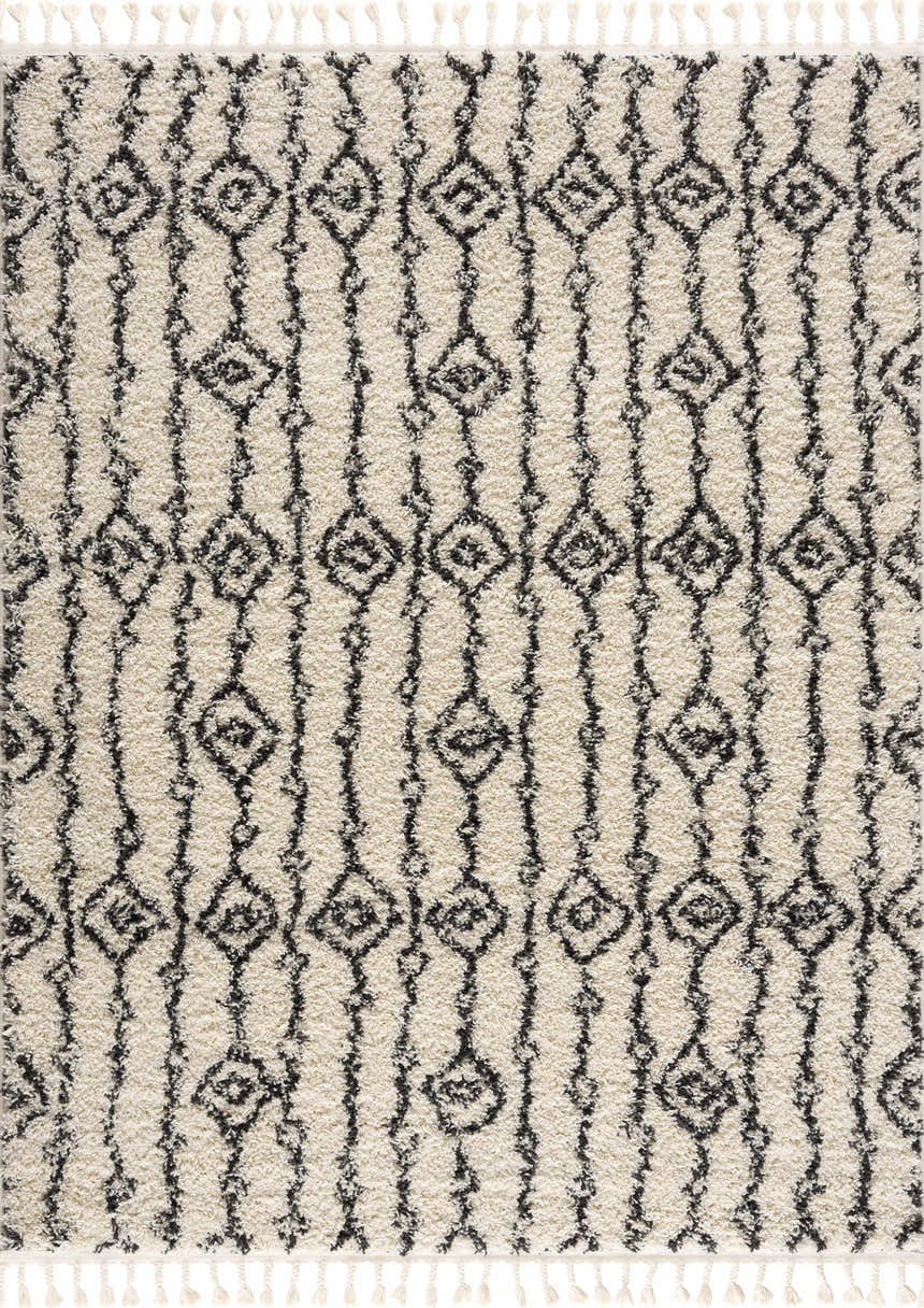 Close-up of the Bayanga rug, a shag rug with a black geometric Moroccan-inspired design on a light gray background. Design-Rectangle
