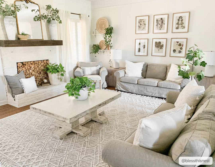 Living room scene with a neutral palette featuring the Ramsbury Wool Area Rug in black and ivory geometric pattern. Roomscene-Rectangle