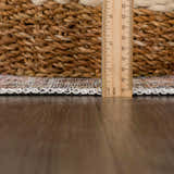 Close-up of Flat Pile Urpi Red Washable Rug showing its flat construction, edge binding, and multi-color vintage pattern. Pile