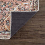 Close-up of the Flat Pile Urpi Red Washable Rug showing its vintage Persian design, red tones, and non-slip backing. Fold