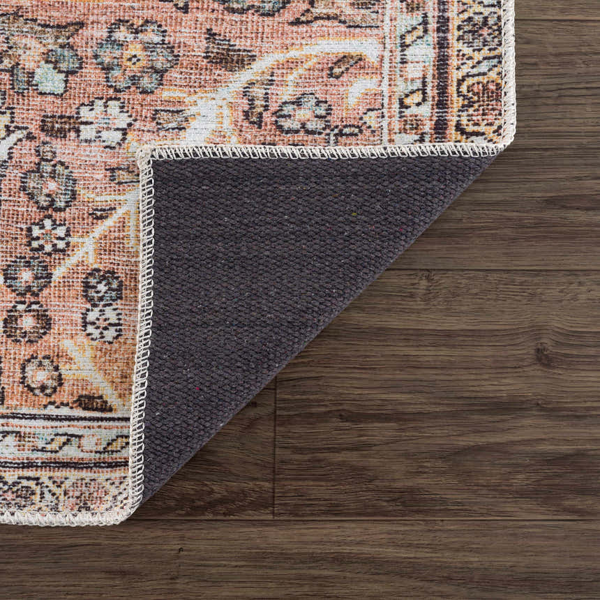 Close-up of the Flat Pile Urpi Red Washable Rug showing its vintage Persian design, red tones, and non-slip backing. Fold