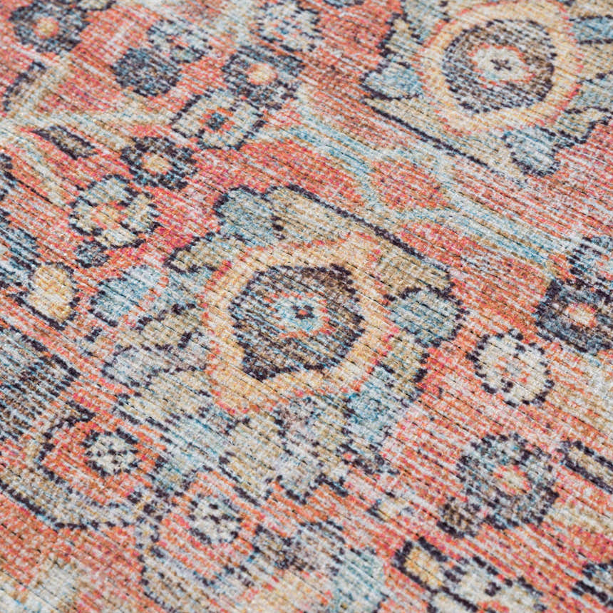 Close-up of the Urpi Rose & Blue Washable Area Rug showing its traditional Persian-style floral pattern and texture. Texture
