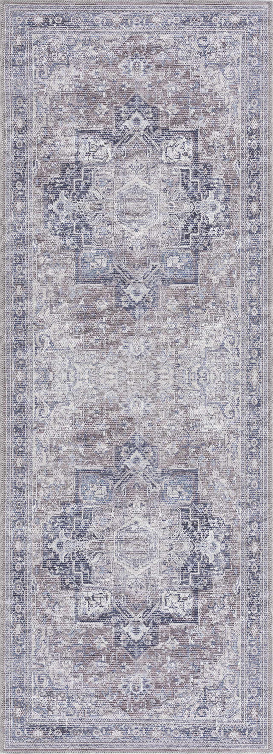 Close-up of the Abner Washable Area Rug. Traditional pattern in brown, charcoal, denim, and ivory tones. Machine woven texture. Design-Runner-2773