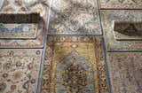 Variety of hand-tufted Rozel Area Rugs in brown, orange, sage, gray, and teal, showcasing oriental and traditional patterns. Styleshot