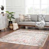 Living room with gray sofa and Bolinas Area Rug in brick red, camel, and light gray. Roomscene-Rectangle