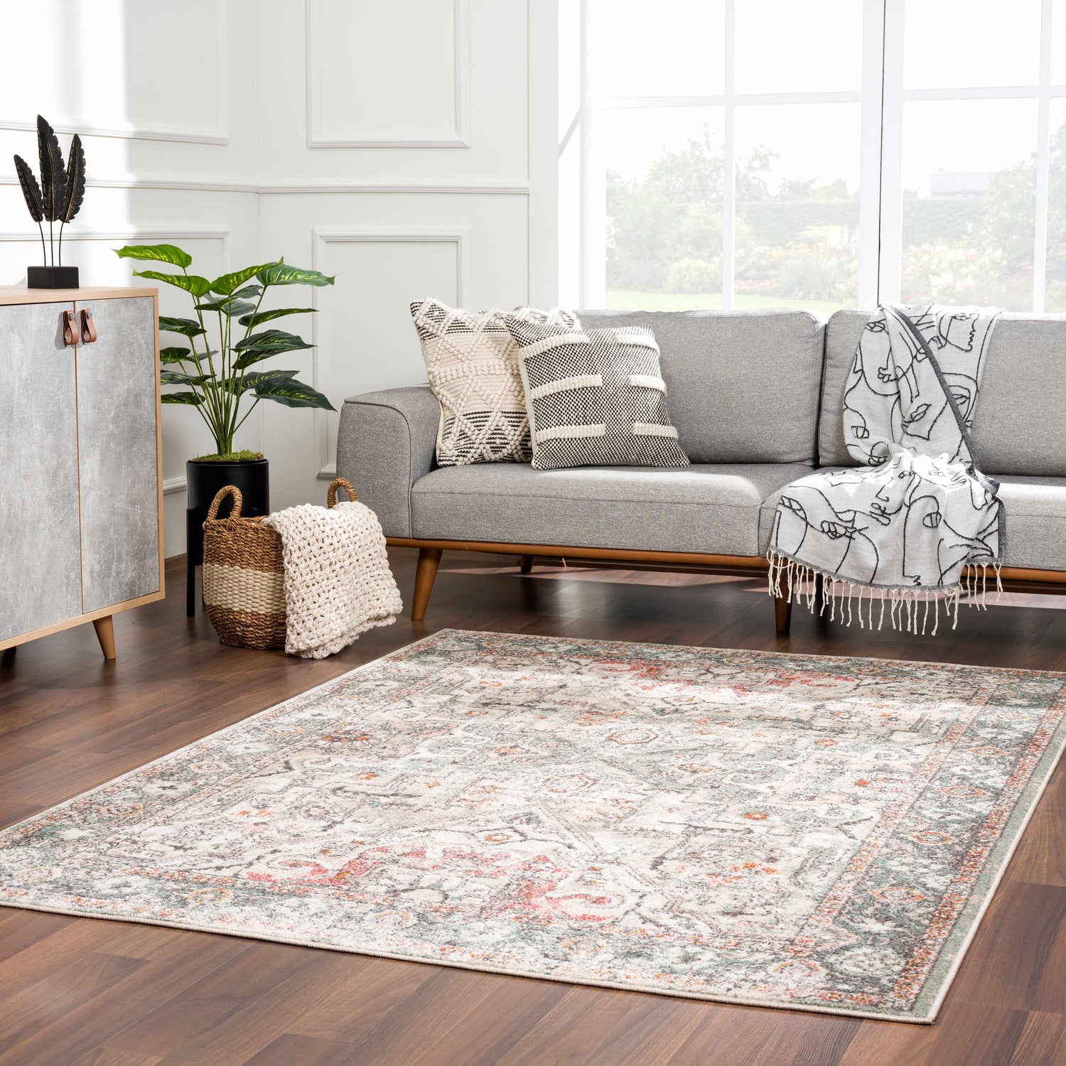 Living room with gray sofa and Bolinas Area Rug in brick red, camel, and light gray. Roomscene-Rectangle