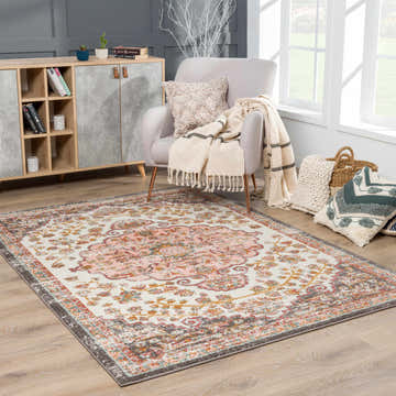 Cozy living room scene with Oark Floral Medallion Area Rug, gray armchair, wood cabinet, and natural light. Roomscene-Rectangle