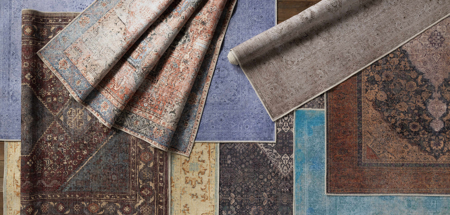 Close-up of Kittrell Vintage Flat Pile Washable Rugs in beige, red, plum, blue, rose, and teal with a traditional, vintage pattern. Styleshot
