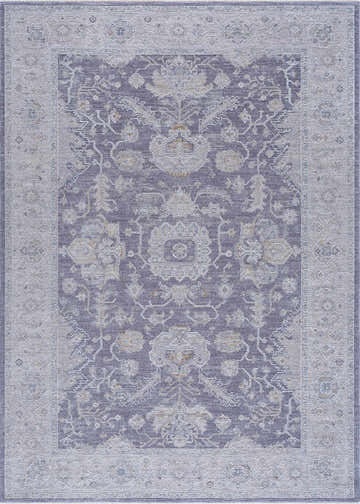 Close-up of the Karuah Thick Luxe Statement Rug. Features a traditional Persian-style pattern in shades of gray, denim, and beige. Design-Rectangle-6796