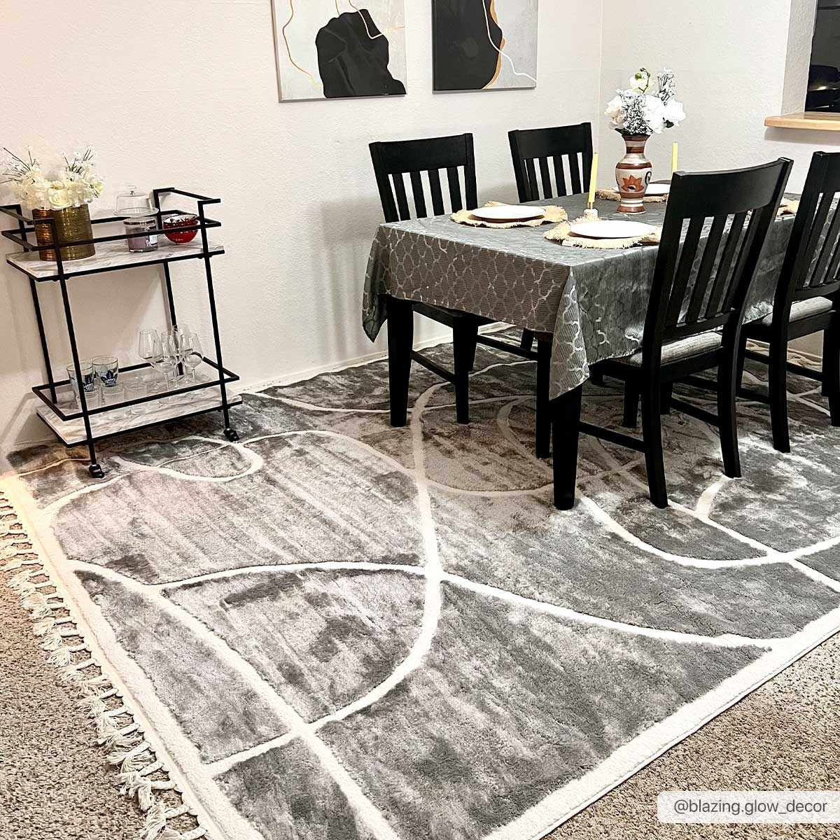 Dining room with Azana Modern Gray Area Rug, black chairs, gray tablecloth, and bar cart. Roomscene-Rectangle