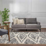 Living room scene with gray sofa and Fishhook Berber Shag Rug in dark gray and lambswool. Roomscene-Rectangle