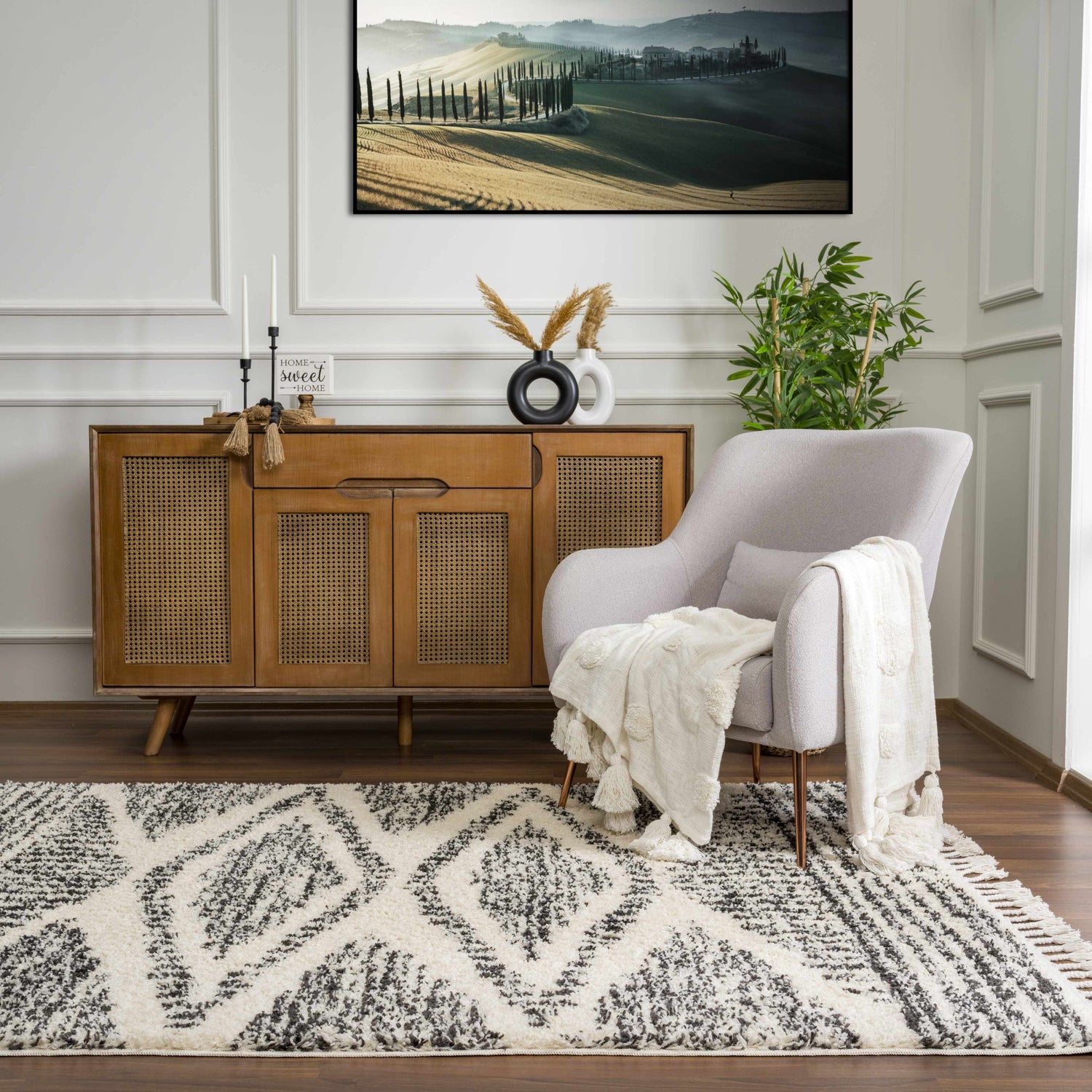 Living room scene with a gray armchair and a Fishhook Berber Shag Rug in dark gray and lambswool. Roomscene-Rectangle
