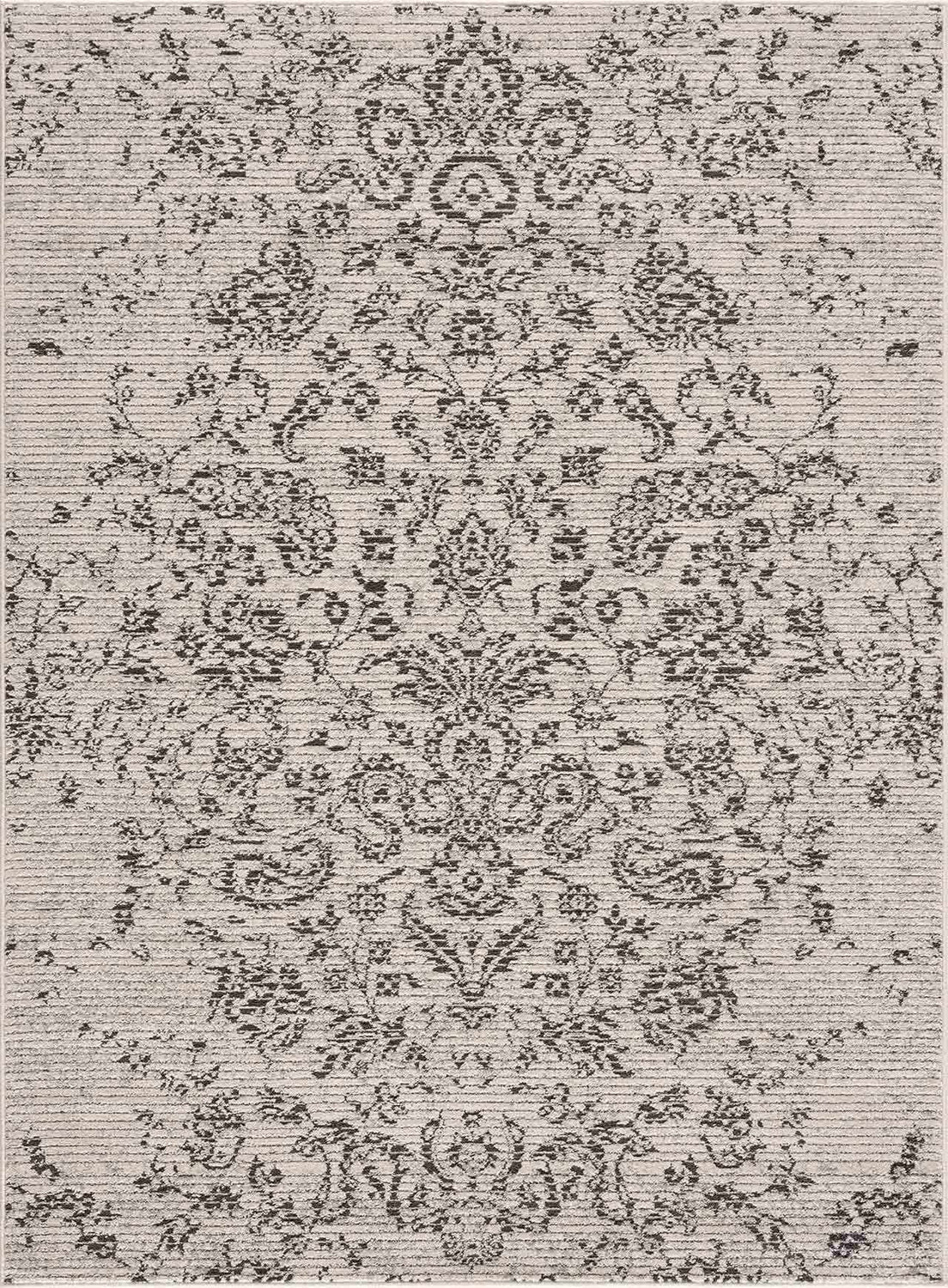 Close-up of the Paicines Area Rug. Charcoal floral pattern on a light beige background with subtle horizontal texture. Design-Rectangle-5373