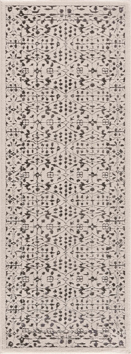 Close-up of the Sattley Area Rug. Beige rug with charcoal, transitional pattern. Machine woven. Design-Runner-2773
