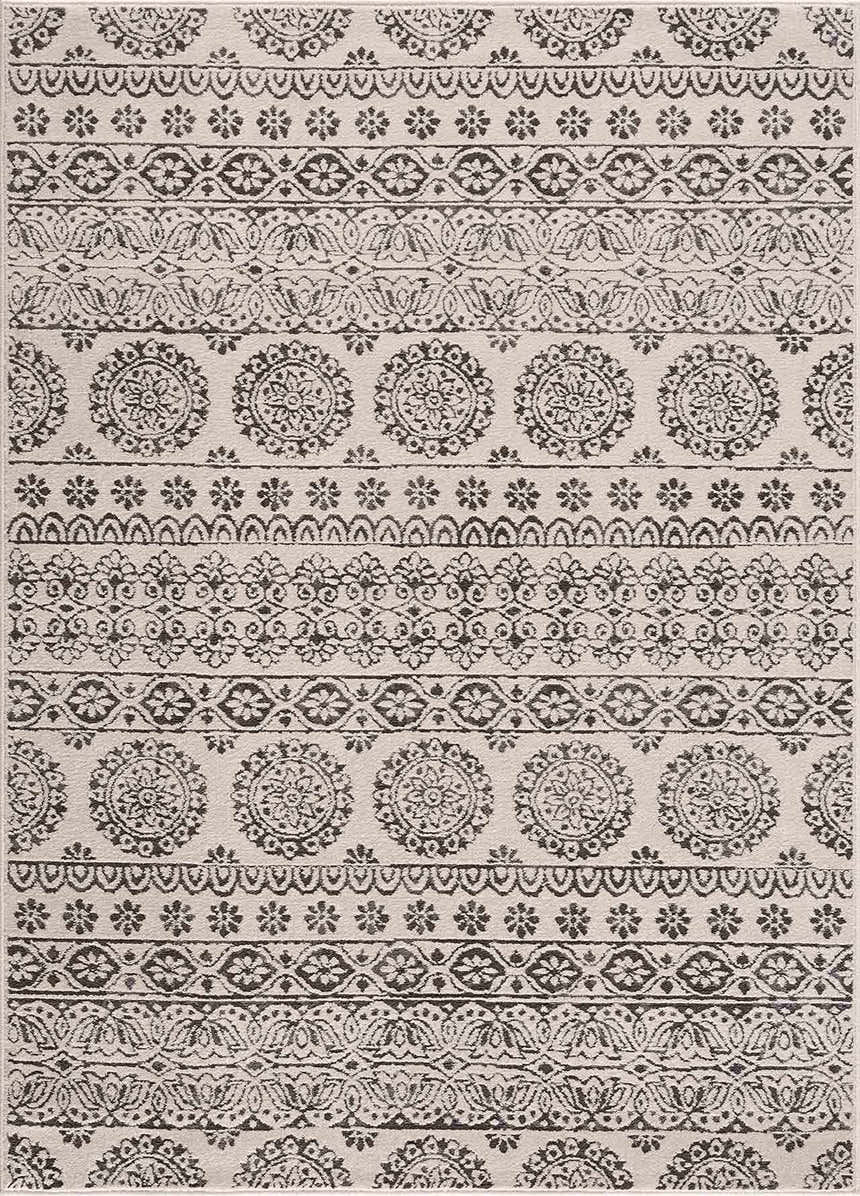 Close-up of the Warroad Area Rug. Charcoal and light beige rug with a traditional, bohemian-inspired medallion pattern. Design-Rectangle-5373