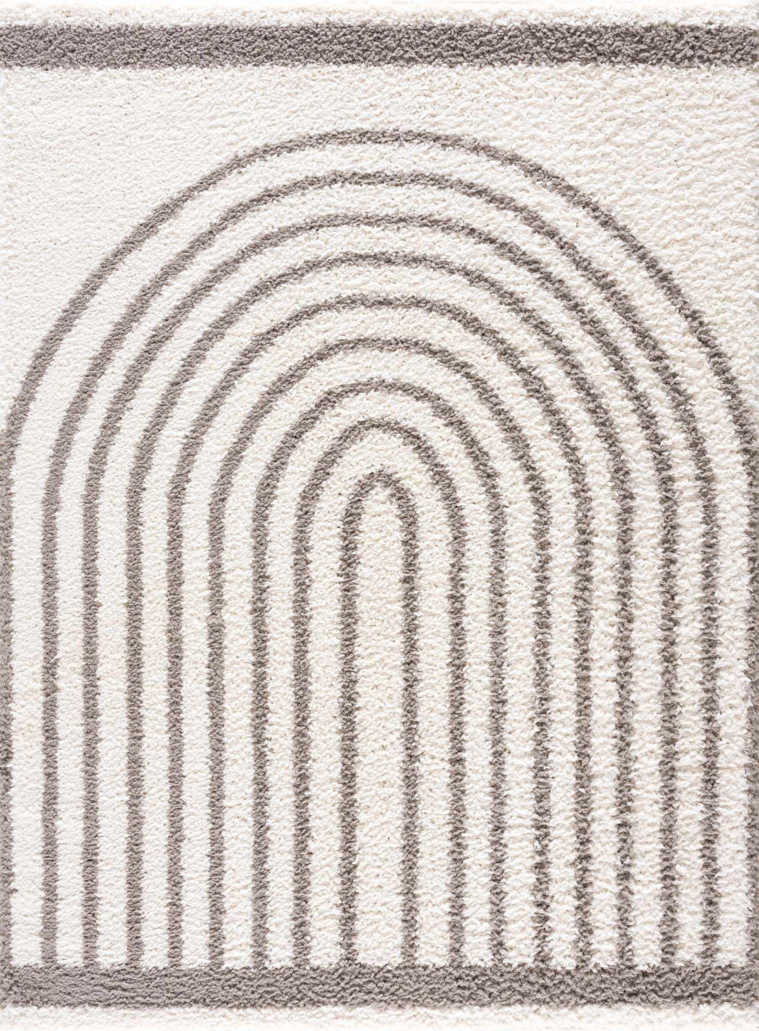 Close up of the Jola Taupe Area Rug showing a geometric rainbow pattern in taupe on a textured, off-white shag pile. Design-Rectangle-537
