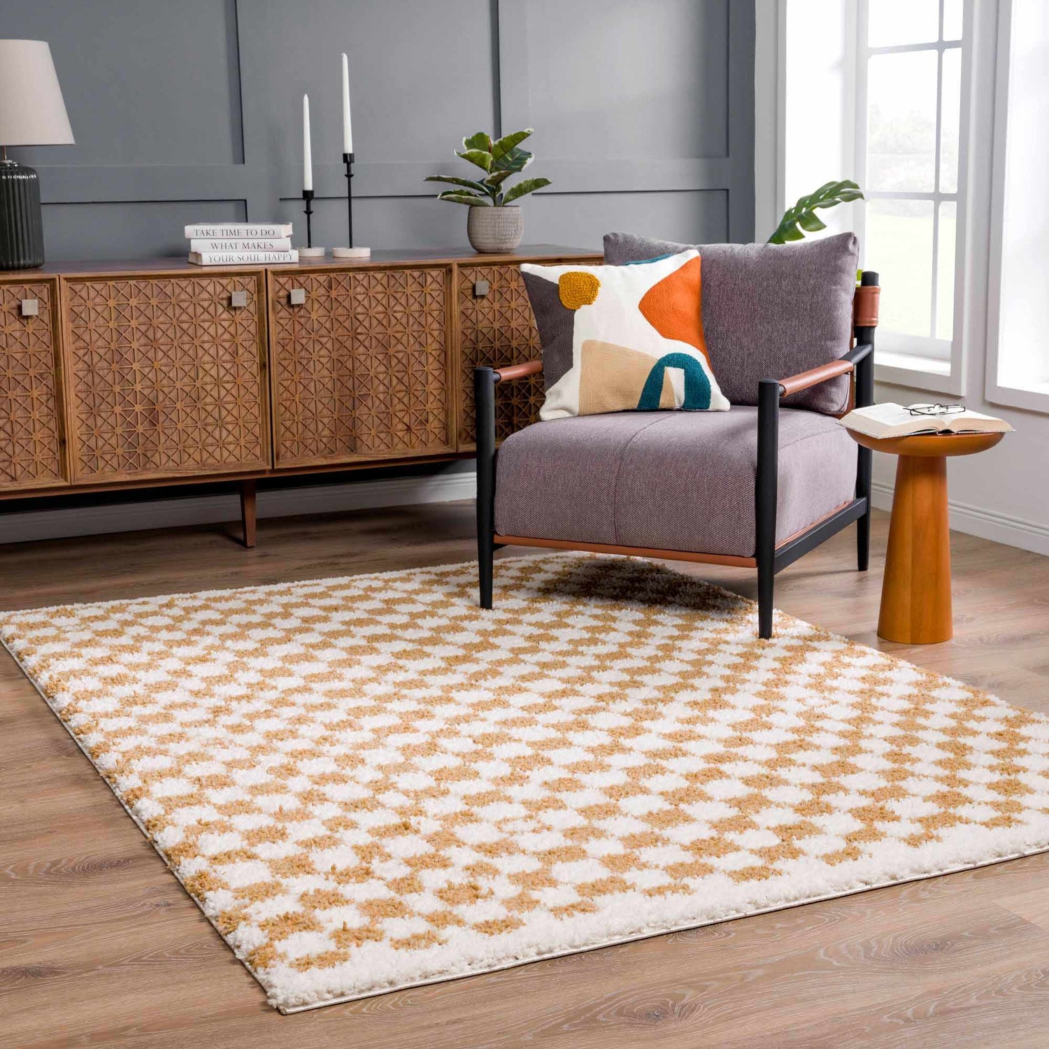 Living room scene with a Kieu Mustard & Ivory Checkered Area Rug, gray chair, and mid-century modern cabinet. Roomscene-Rectangle